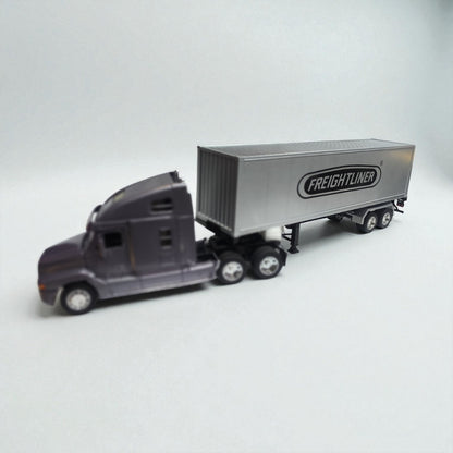 Freightliner Columbia 1:32 Gris Oscuro – Camión Clásico de Carga en Edición Coleccionable